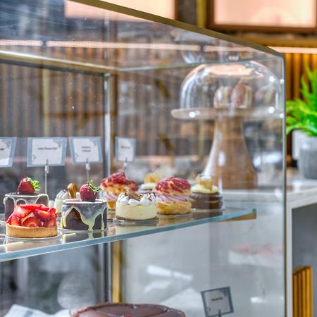 The First Collection Dubai Business Bay Hotel Exterior photo "The pastry shop is open for business"