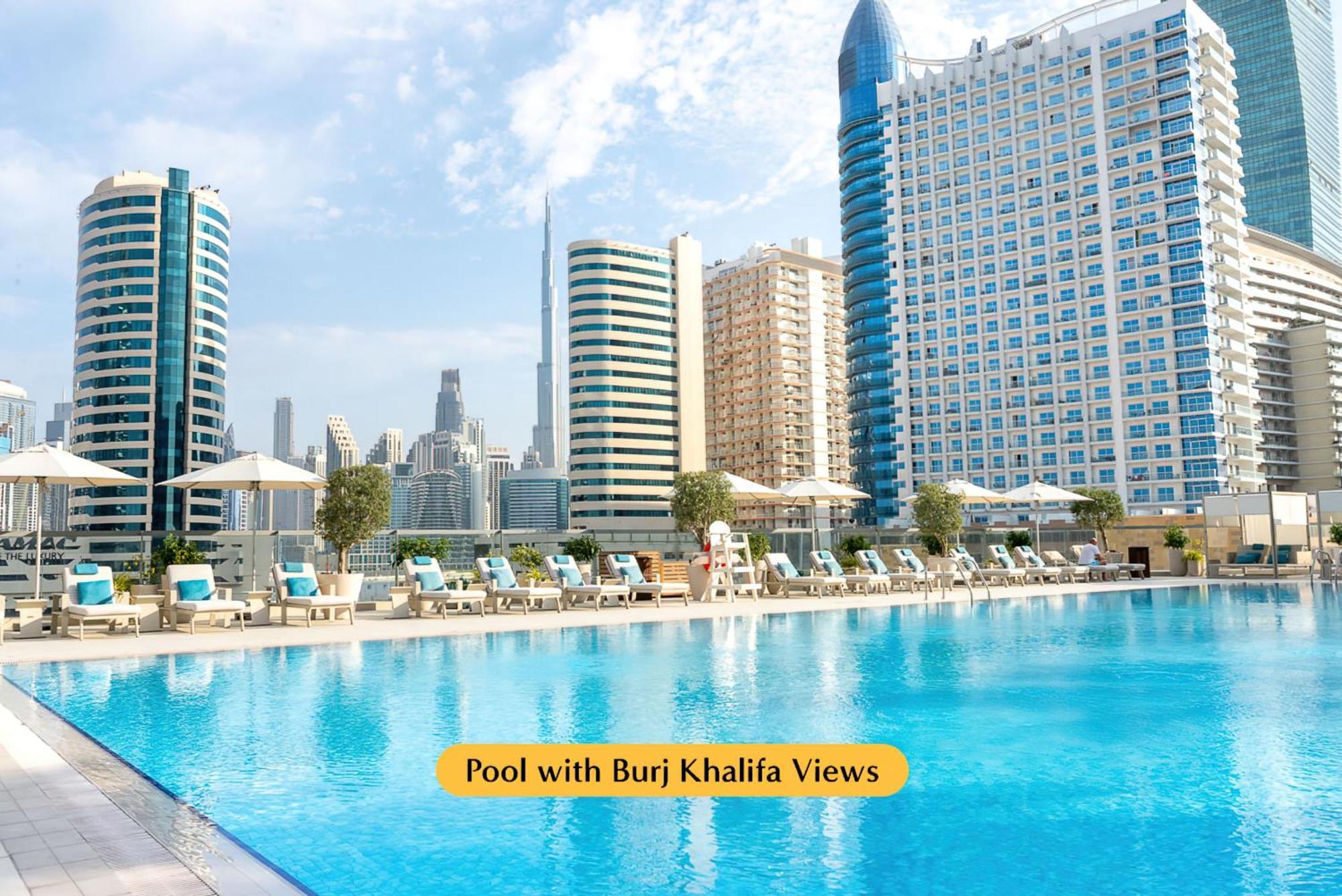 The First Collection Dubai Business Bay Hotel Exterior photo Pool with Burj Khalifa views