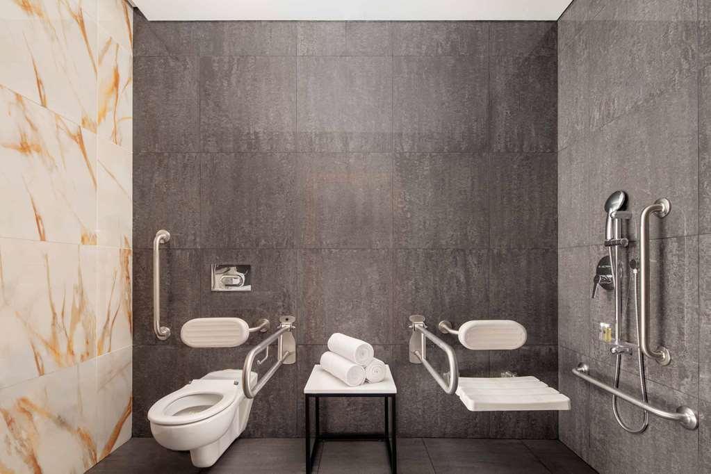 The First Collection Dubai Business Bay Hotel Exterior photo Bathroom with toilet seat and shower seat