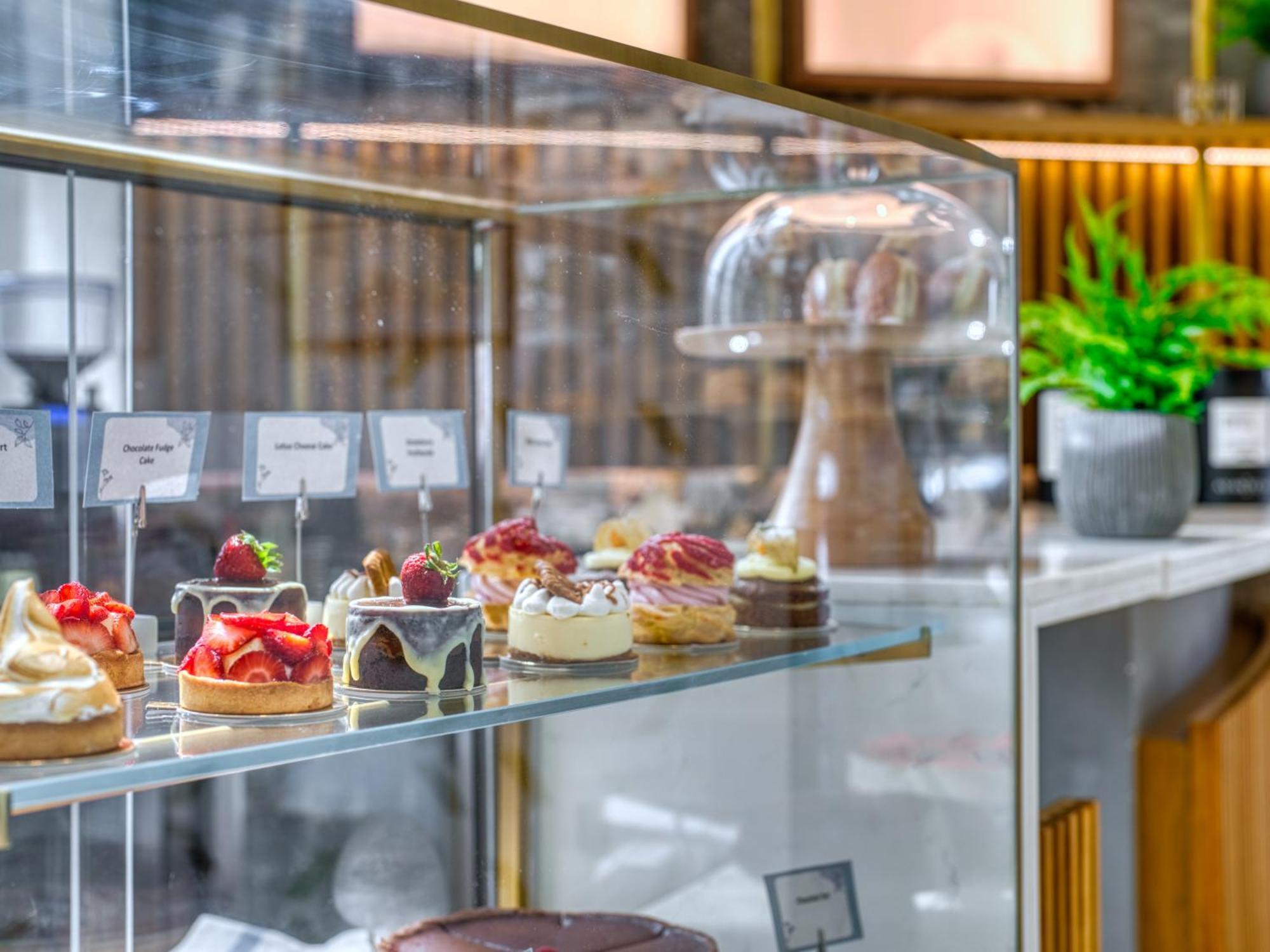 The First Collection Dubai Business Bay Hotel Exterior photo "The pastry shop is open for business"